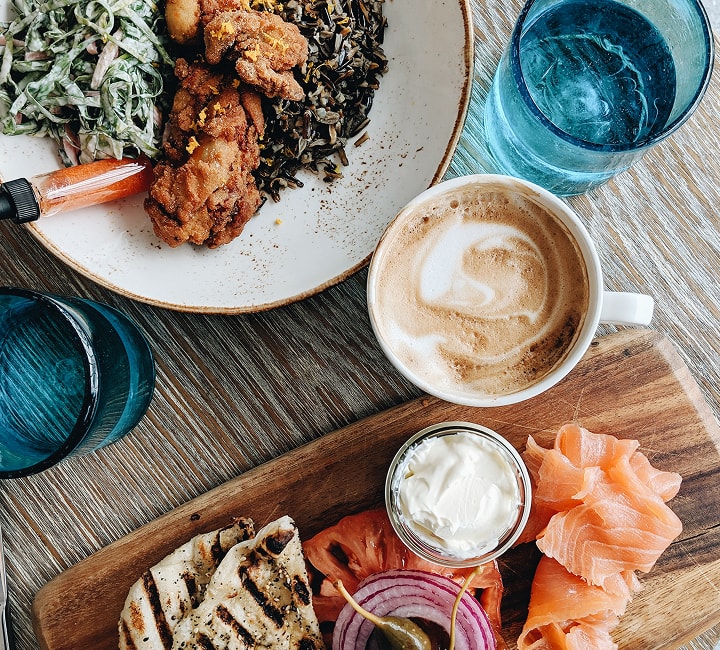 Wild&Org meal with coffee and sides on a wooden table
